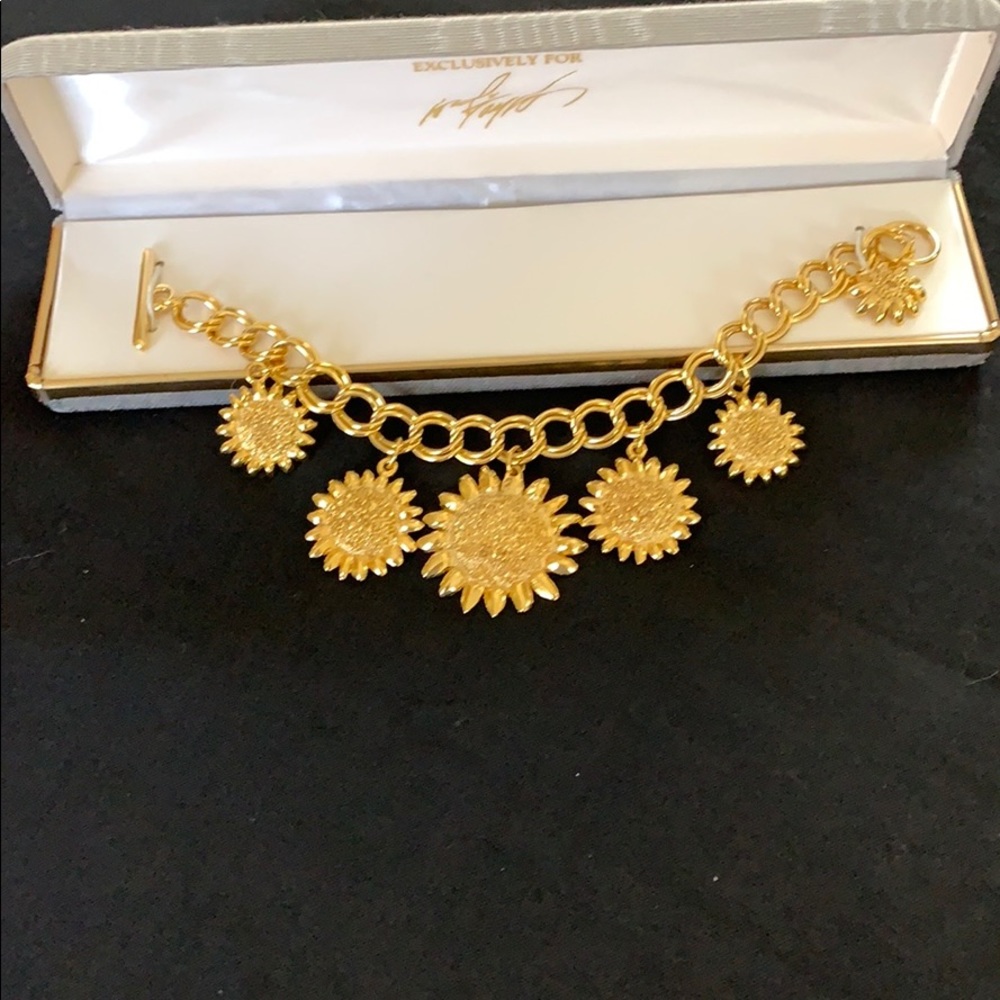 Sun charm gold tone bracelet